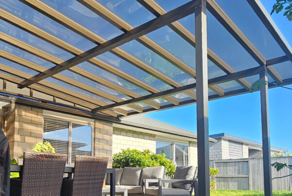 Looking up through a pergola with glass inserts.