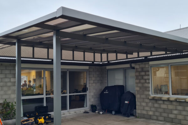 A pergola covers a patio area.