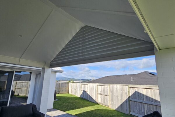 Looking through decorative louvre installed in the peak of a pergola.