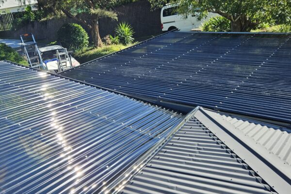 Detail photo from above showing pergola expertly attached to existing structure roof.