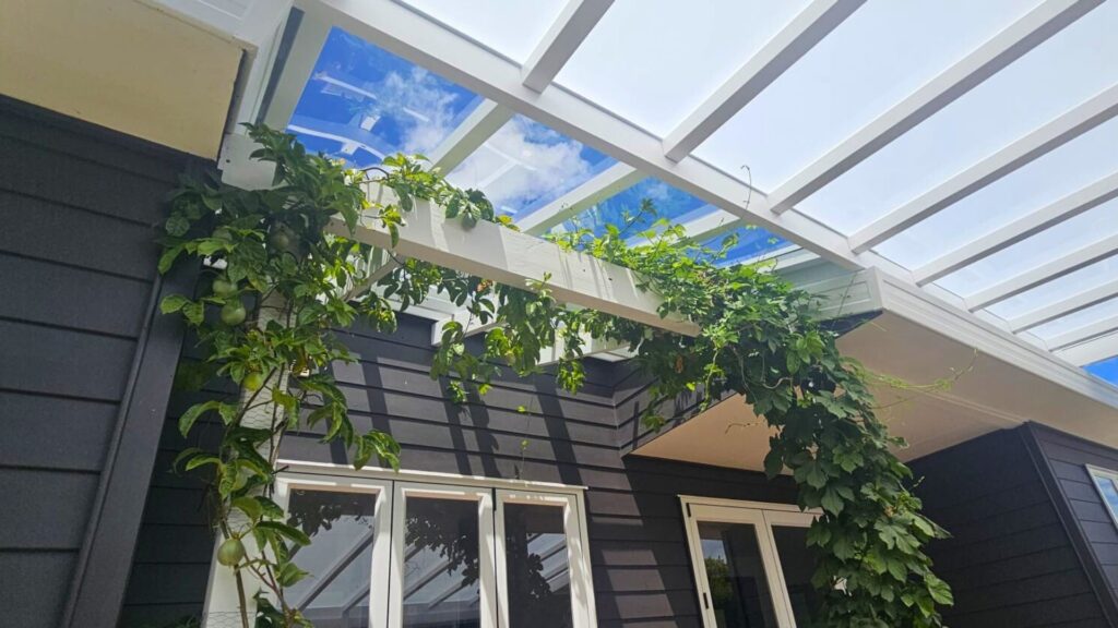 A pergola roof with clear and opal tint.